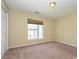 This cozy bedroom offers plush carpeting, a window for natural light and closet space for storage at 535 Donatello Ave, Charlotte, NC 28205
