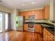 Beautiful kitchen with stainless steel appliances, granite countertops, and hardwood floors at 535 Donatello Ave, Charlotte, NC 28205