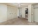 Spacious bedroom featuring carpeted floors, ceiling fan, and an ensuite bathroom with shower at 6005 Fringe Tree Dr, Charlotte, NC 28227