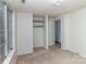 Bright bedroom includes a built-in closet and natural light at 6005 Fringe Tree Dr, Charlotte, NC 28227