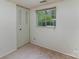 Bedroom with carpet, a window, and a built-in closet at 6005 Fringe Tree Dr, Charlotte, NC 28227