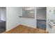 Dining space and kitchen showing wood flooring and access to a breakfast bar at 6005 Fringe Tree Dr, Charlotte, NC 28227