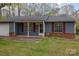 Charming single-story home with blue siding, red shutters, and a covered front porch at 6005 Fringe Tree Dr, Charlotte, NC 28227