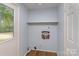 Bright laundry room with hookups and a door leading to the outside at 6005 Fringe Tree Dr, Charlotte, NC 28227