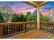 Outdoor deck with wooden railings and a view of the yard and surrounding neighborhood at 6020 Union Pacific Ave, Charlotte, NC 28210