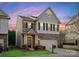 Charming two-story home featuring a stone facade, well-manicured lawn, and an attached two-car garage at 6020 Union Pacific Ave, Charlotte, NC 28210