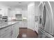 Modern kitchen with granite countertops, stainless steel appliances, and white cabinetry for a clean aesthetic at 6020 Union Pacific Ave, Charlotte, NC 28210