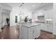 Open-concept kitchen with a center island, pendant lighting, and views to the backyard for seamless indoor-outdoor living at 6020 Union Pacific Ave, Charlotte, NC 28210