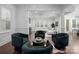 Cozy living room showcasing hardwood floors, fireplace, ample seating, and bright, airy atmosphere at 6020 Union Pacific Ave, Charlotte, NC 28210