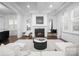 Comfortable living room with fireplace, bright natural light, and elegant decor, creating a welcoming space at 6020 Union Pacific Ave, Charlotte, NC 28210