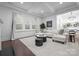 Bright living room with hardwood floors, stylish furniture, and ample natural light from large windows at 6020 Union Pacific Ave, Charlotte, NC 28210