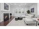 Cozy living room features a fireplace, neutral decor, and comfortable seating for relaxing and entertaining at 6020 Union Pacific Ave, Charlotte, NC 28210