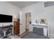 Comfortable bedroom with built-in bed, and adjacent desk, dresser, and open doorway at 631 W Tremont Ave, Charlotte, NC 28203