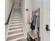 Welcoming entryway featuring stairs, coat rack, bench, and a charming 'Welcome' sign at 631 W Tremont Ave, Charlotte, NC 28203
