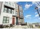 A modern townhome showcases a bright facade with stepped entrances and architectural details at 631 W Tremont Ave, Charlotte, NC 28203