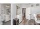 Hallway with an open door, closet, full-length mirror, and a glimpse of the full bathroom at 631 W Tremont Ave, Charlotte, NC 28203