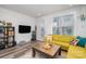 Cozy living room features a bright sofa, modern decor, and large windows for ample natural light at 631 W Tremont Ave, Charlotte, NC 28203