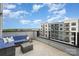 Inviting rooftop deck with comfortable blue seating, offering a perfect space to unwind with skyline views at 631 W Tremont Ave, Charlotte, NC 28203