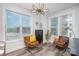 Bright sitting area with stylish chairs and a modern light fixture and an abundance of natural light at 631 W Tremont Ave, Charlotte, NC 28203