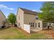 A well-maintained backyard with a privacy fence, patio area, and lush lawn at 6619 Portland Rose Ln, Charlotte, NC 28210