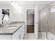 Spacious bathroom featuring granite countertops, tile floors and a glass shower at 6619 Portland Rose Ln, Charlotte, NC 28210