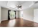 Bedroom featuring a trey ceiling, wood floors, and a window at 6619 Portland Rose Ln, Charlotte, NC 28210