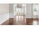 Formal dining room featuring wainscoting and large windows at 6619 Portland Rose Ln, Charlotte, NC 28210
