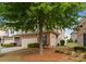 Charming townhome with a stone facade, attached garage, and well-manicured landscaping at 6619 Portland Rose Ln, Charlotte, NC 28210