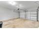 Spacious two-car garage featuring ample room for storage and parking at 6619 Portland Rose Ln, Charlotte, NC 28210