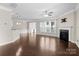 A bright living room with hardwood floors, fireplace, and ample natural light at 6619 Portland Rose Ln, Charlotte, NC 28210