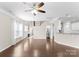Open-concept living room featuring hardwood floors and natural light at 6619 Portland Rose Ln, Charlotte, NC 28210