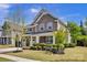 Charming two-story home showcasing a stone facade, complemented by a well-manicured lawn and neutral color palette at 704 Fresia Dr, Tega Cay, SC 29708