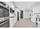 Spacious kitchen boasting white cabinets, stainless steel appliances, and ample counter space for meal preparation at 704 Fresia Dr, Tega Cay, SC 29708
