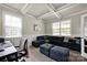 Inviting living room with coffered ceiling, plush seating, and large windows offering ample natural light at 704 Fresia Dr, Tega Cay, SC 29708