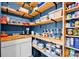 Well-organized pantry with wooden shelves, blue walls and countertop at 704 Fresia Dr, Tega Cay, SC 29708