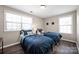 Charming bedroom with hardwood floors, ample natural light, and two twin beds at 704 Fresia Dr, Tega Cay, SC 29708