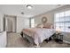 Inviting bedroom features soft carpet, natural light, and comfortable furnishings at 704 Fresia Dr, Tega Cay, SC 29708