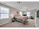 Inviting bedroom features soft carpet, natural light, and comfortable furnishings at 704 Fresia Dr, Tega Cay, SC 29708