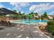 Resort-style community pool with splash pad, slide, and lounge chairs, offering a luxurious outdoor experience at 704 Fresia Dr, Tega Cay, SC 29708