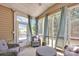 Cozy screened porch with comfortable seating and outdoor ambiance at 704 Fresia Dr, Tega Cay, SC 29708