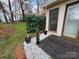 Landscaped backyard with a patio and easy access to the home's rear entrance at 715 21St Ne Ave, Hickory, NC 28601