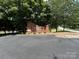 Community entrance with brick sign and mature trees at 715 21St Ne Ave, Hickory, NC 28601