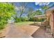 Large backyard with grass, a shed, mature trees, and a screened porch at 764 Emorywood Ln, Rock Hill, SC 29730