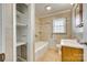 Bathroom featuring neutral tiling, a bathtub, and built-in storage at 764 Emorywood Ln, Rock Hill, SC 29730