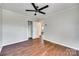 Bedroom featuring wood-look floors, a ceiling fan, closet and access to additional room at 764 Emorywood Ln, Rock Hill, SC 29730