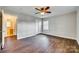 Bedroom featuring wood-look floors, a ceiling fan, closet and access to the bathroom at 764 Emorywood Ln, Rock Hill, SC 29730