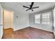 Bedroom featuring wood-look floors, a ceiling fan, and access to additional room at 764 Emorywood Ln, Rock Hill, SC 29730