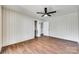 Bedroom featuring wood-look floors, a ceiling fan, closet and access to additional room at 764 Emorywood Ln, Rock Hill, SC 29730