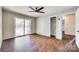 Bedroom featuring wood-look floors, a ceiling fan, closet and access to additional room at 764 Emorywood Ln, Rock Hill, SC 29730