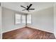 Bedroom featuring wood-look floors, a ceiling fan, and windows for natural light at 764 Emorywood Ln, Rock Hill, SC 29730